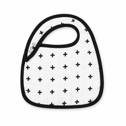 Swiss Cross organic muslin bib from Modern Burlap, front studio view on white.