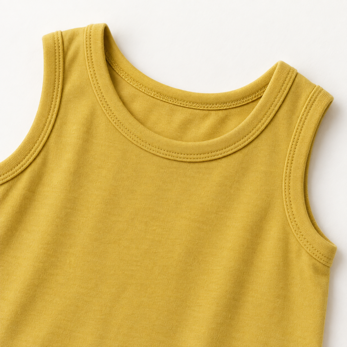 Mustard organic baby tank romper neckline and armhole detail