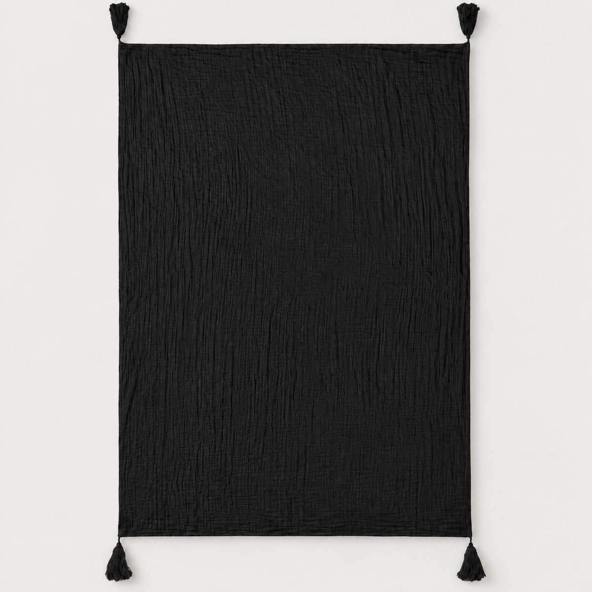 Onyx organic cotton muslin throw fully open with four corner tassels