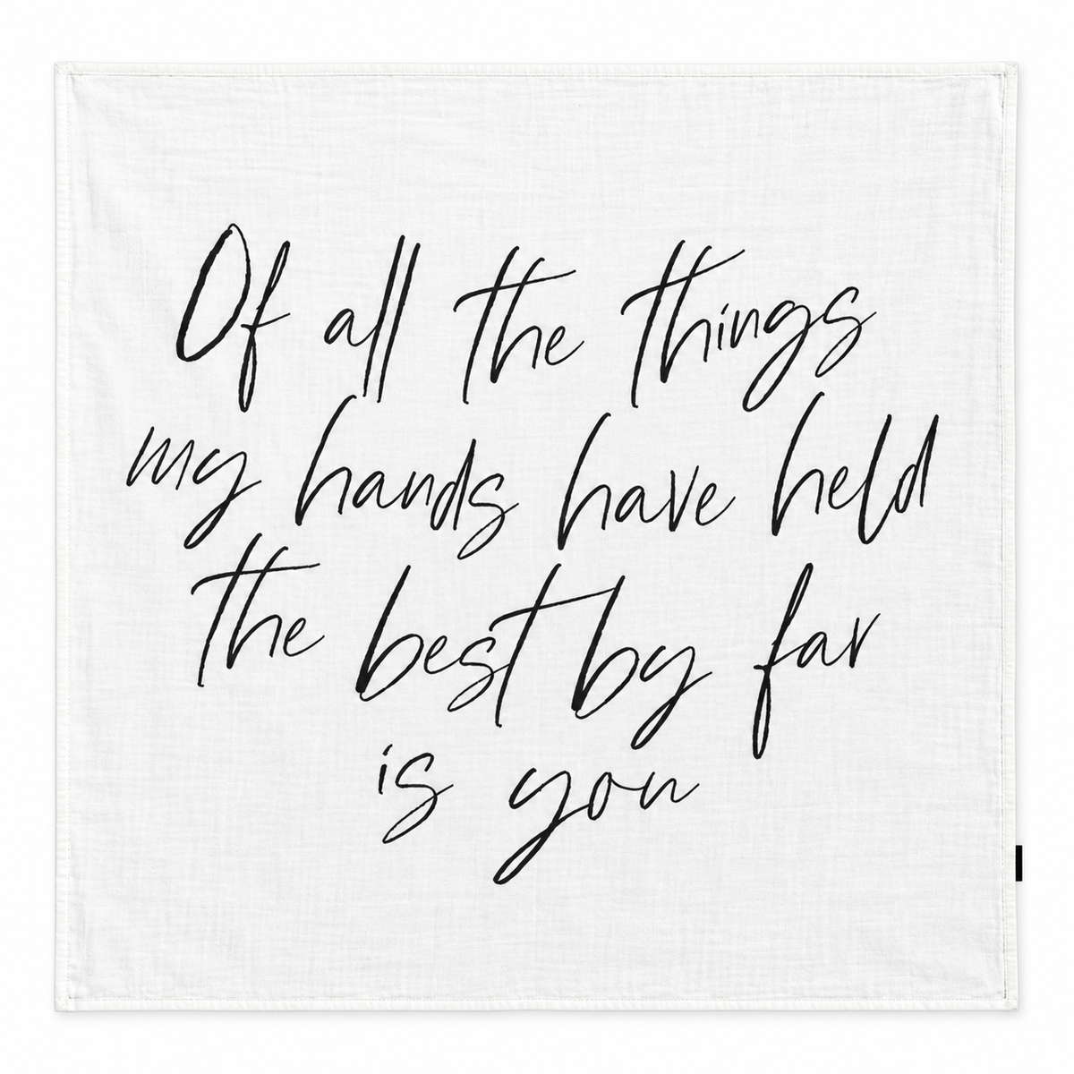 The Best by Far Is You organic muslin swaddle shown fully open and flat on white, with black handwritten lettering.