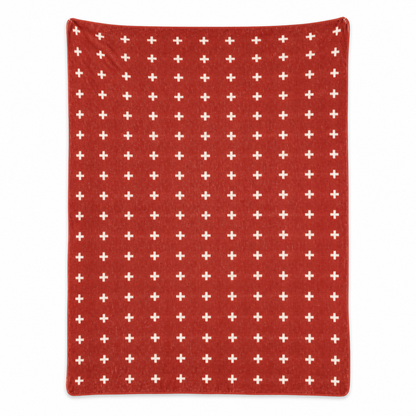 Mini Swiss Cross Recycled Cotton Throw Blanket — Rust Red, studio design reference on white.