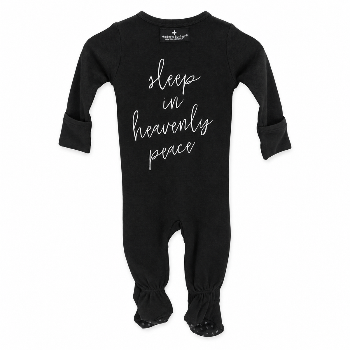 Black Sleep in Heavenly Peace organic button footie with covered feet, back view with white hymn lettering.