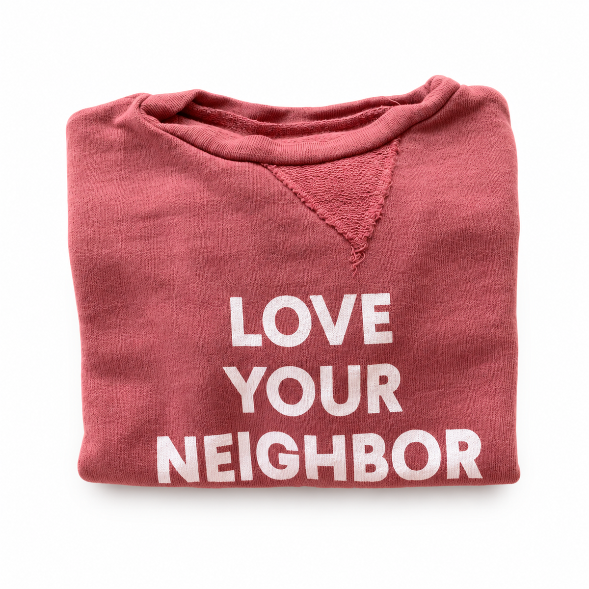 Love Your Neighbor Kids Sweatshirt, folded view showing Love Your Neighbor print on white.