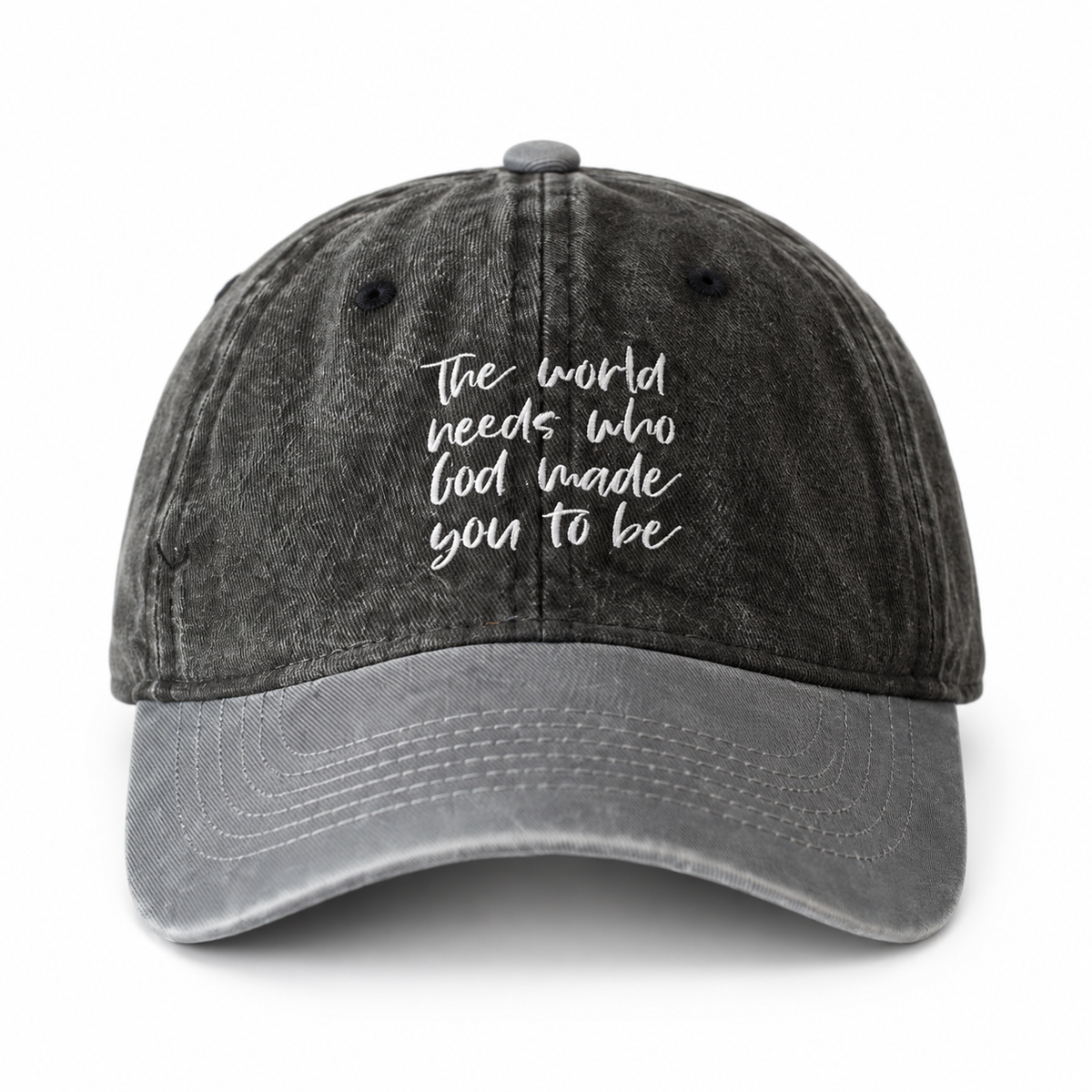 Child-size cap with washed black crown, gray brim, and The world needs who God made you to be embroidery.