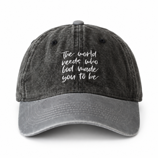 Child-size cap with washed black crown, gray brim, and The world needs who God made you to be embroidery.