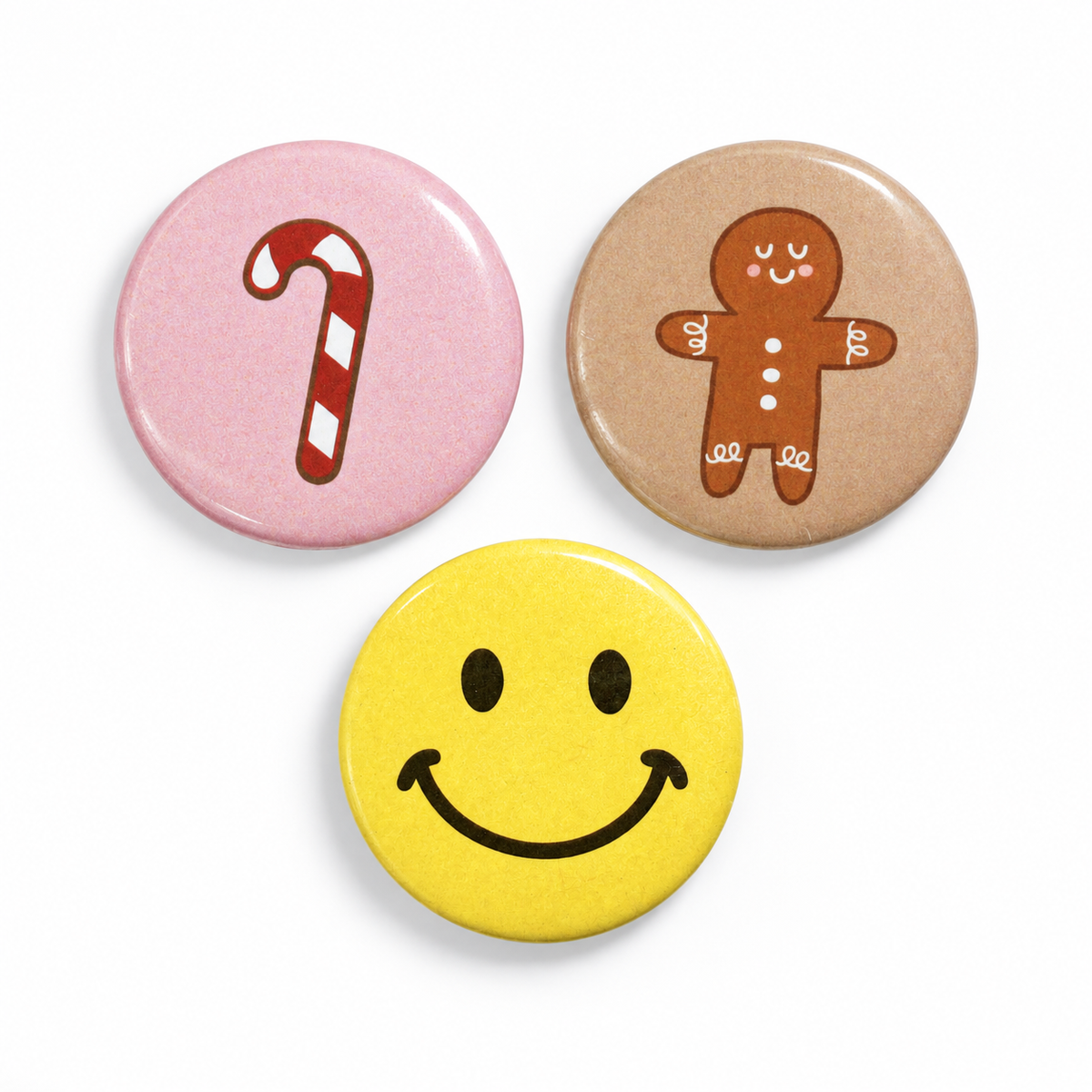 Penny Paper Candy Cane, Gingerbread Man and Retro Happy Face buttons; each design sold separately