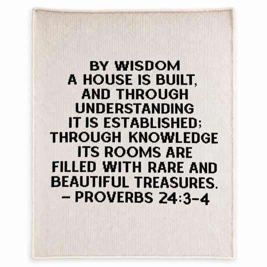 Proverbs 24:3-4 recycled cotton throw — Natural ivory studio flat lay showing full black scripture lettering