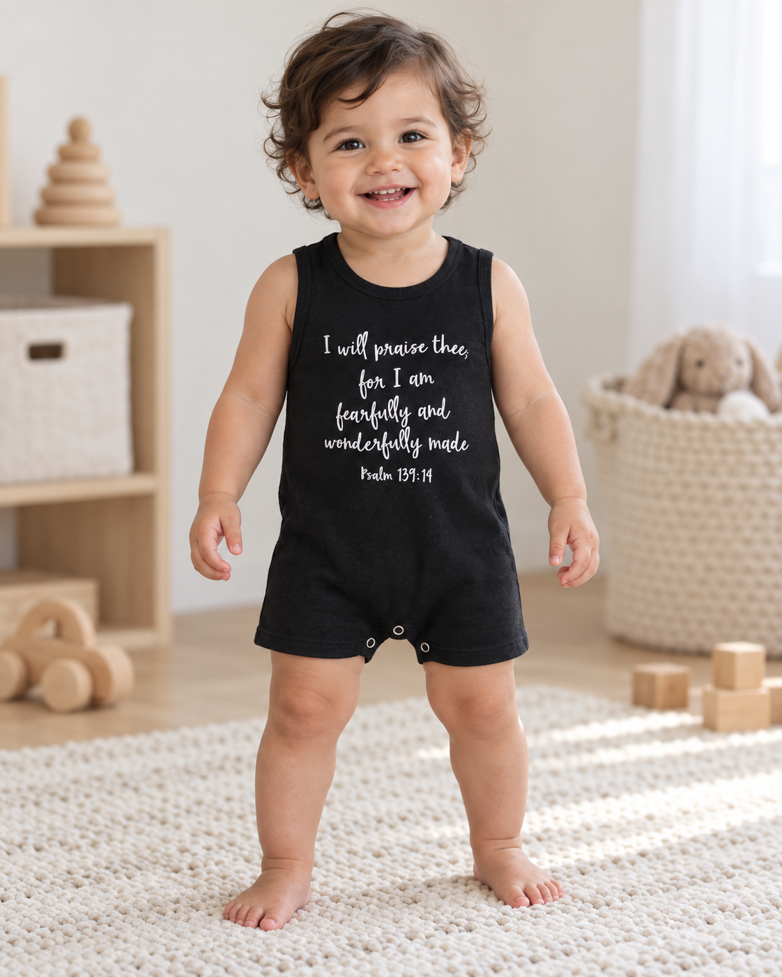 AI-styled toddler wearing the black Psalm 139:14 tank romper, with the front verse and short-leg fit visible.