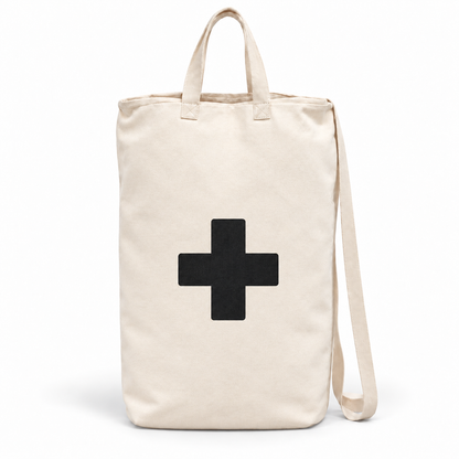 Single Cross ivory cotton canvas bag with black cross, handles and shoulder strap on white