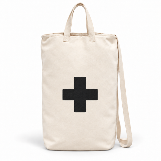 Single Cross ivory cotton canvas bag with black cross, handles and shoulder strap on white