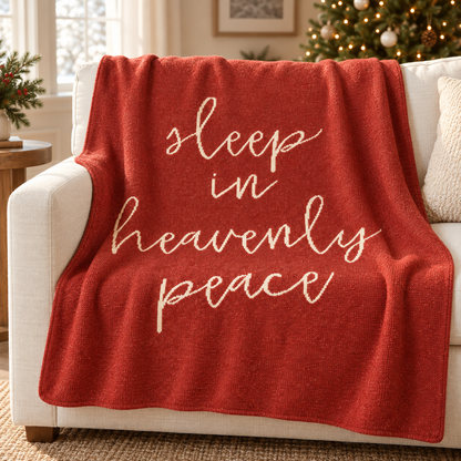 Sleep in Heavenly Peace recycled cotton blanket — Rust Red throw draped on an ivory sofa in a Christmas living room