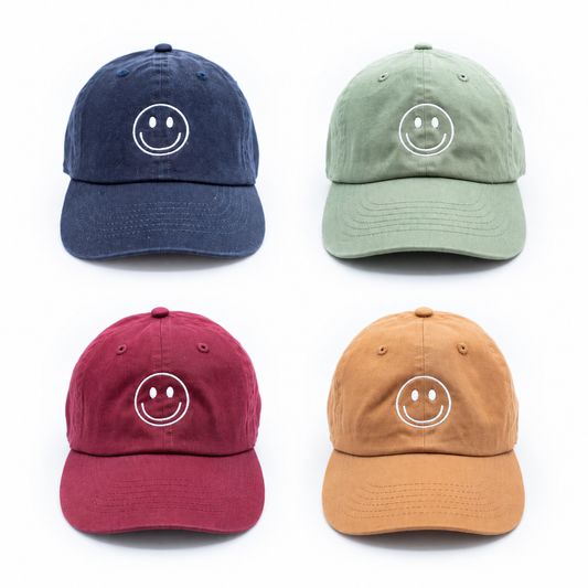 Rey to Z smiley hats in Navy, Dusty Sage, Maroon and Terra Cotta. Displayed at matching scale; select color and size separately.