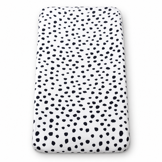 Spots organic changing pad cover fitted on a rectangular pad, shown on white.