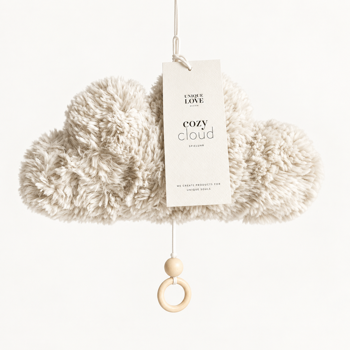 Cozy Cloud music box with textured cream fabric and wooden pull ring.