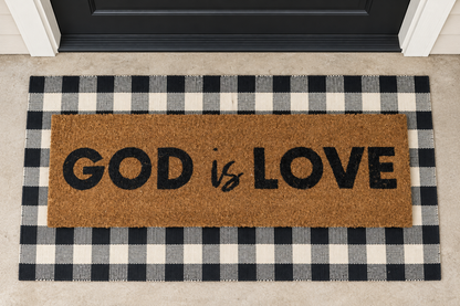 XL Christian Doormat | God Is Love layered over a black and ivory buffalo plaid runner at a black door.