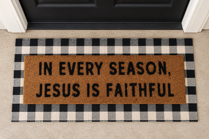 In Every Season, Jesus Is Faithful XL doormat layered over the buffalo plaid runner at a black front door.