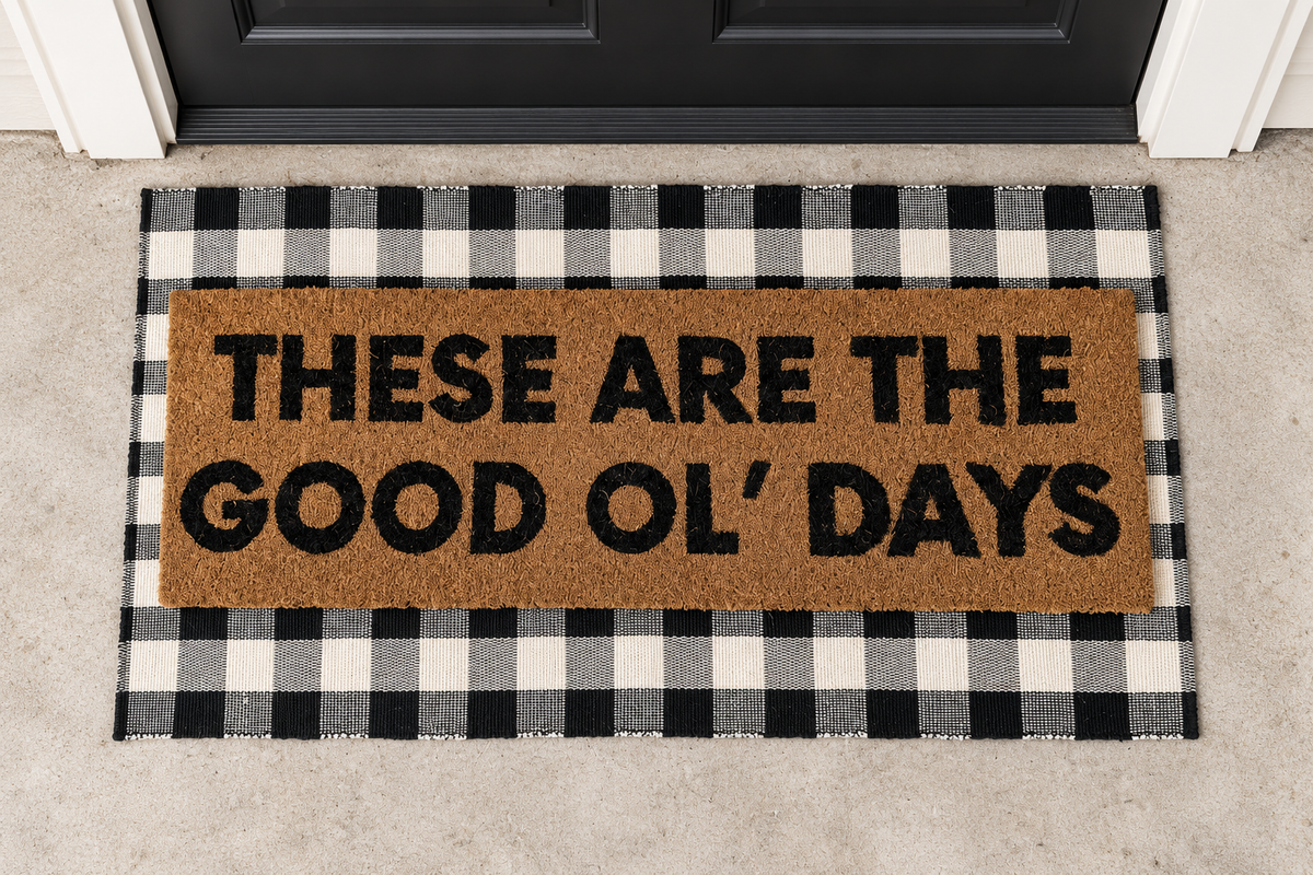 XL Doormat | These Are the Good Ol' Days layered over a black and ivory buffalo plaid runner at a black door.