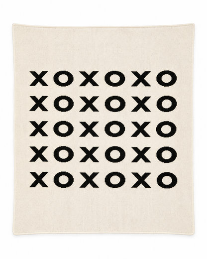XO throw blanket in Natural, full studio view on white.