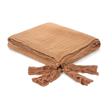 Folded ginger organic cotton muslin XL throw blanket with tassels