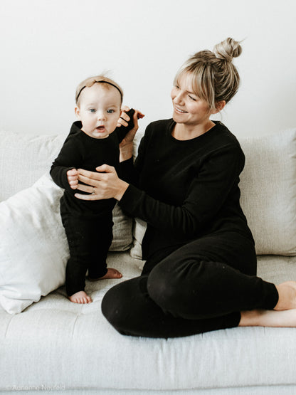 Organic Baby + Kids Pajama Set | Black — Parent and baby wearing matching black pajamas