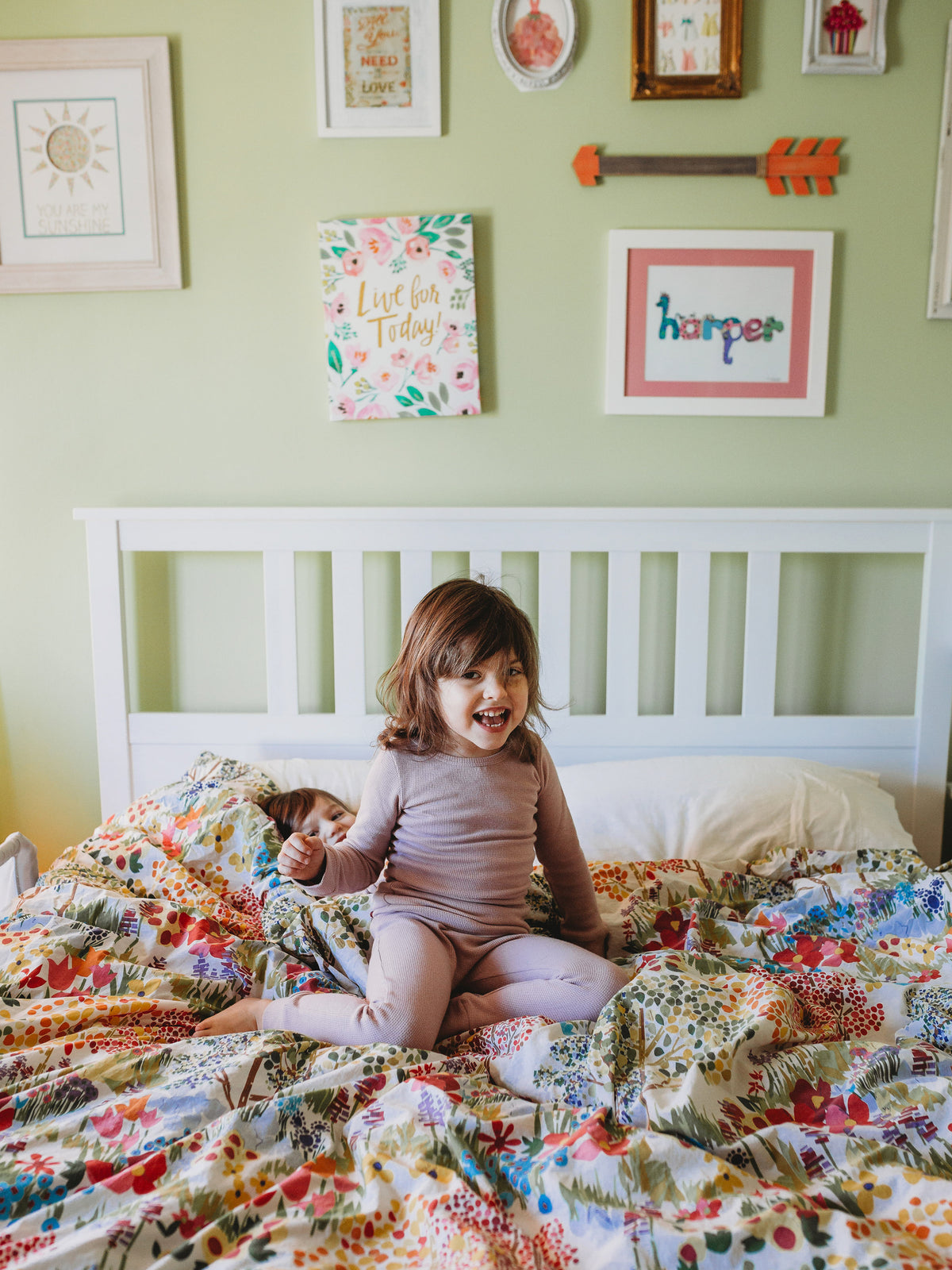 Organic Thermal Baby + Kids Pajama Set | Mauve — Child wearing the full set on a bed