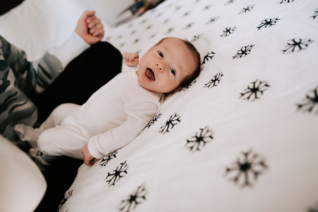 Snowflakes organic cotton muslin swaddle by Modern Burlap