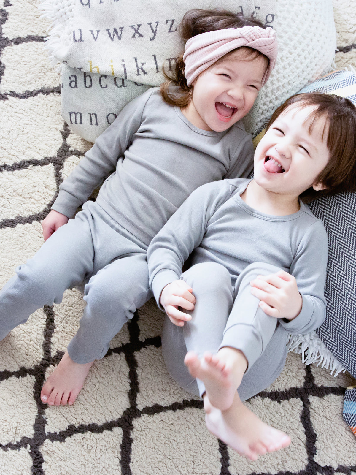 Organic Baby + Kids Pajama Set | Neutral Gray — Children wearing matching gray pajamas