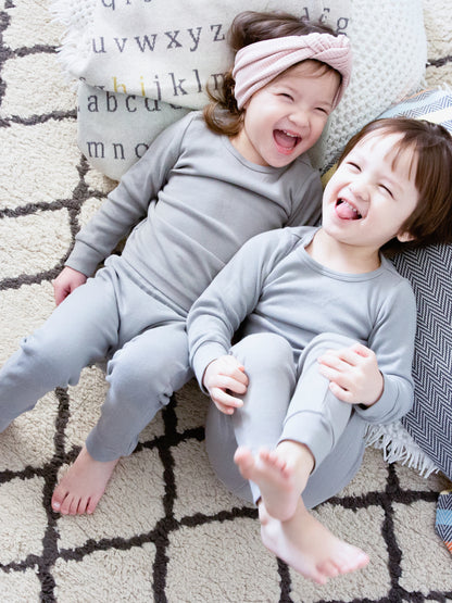 Organic Baby + Kids Pajama Set | Neutral Gray — Children wearing matching gray pajamas