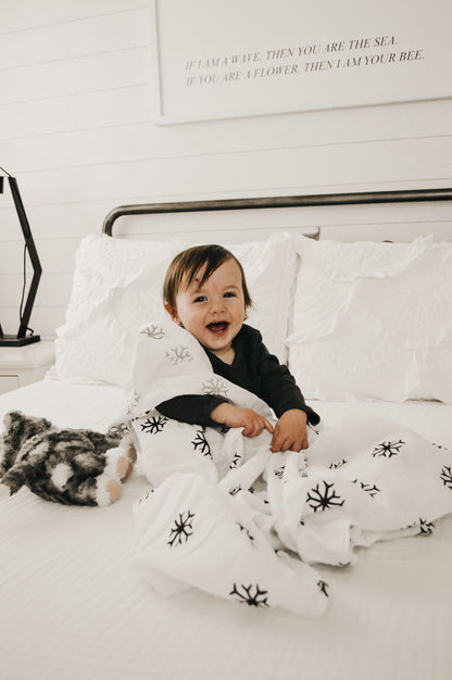 Snowflakes organic cotton muslin swaddle by Modern Burlap