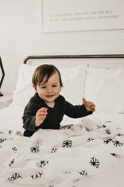 Snowflakes organic cotton muslin swaddle by Modern Burlap