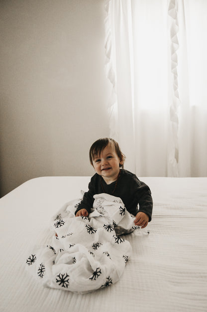 Snowflakes organic cotton muslin swaddle by Modern Burlap