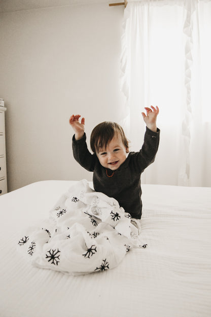 Snowflakes organic cotton muslin swaddle by Modern Burlap