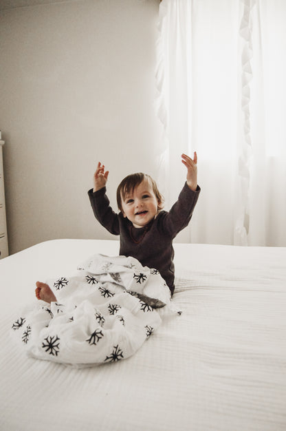 Snowflakes organic cotton muslin swaddle by Modern Burlap