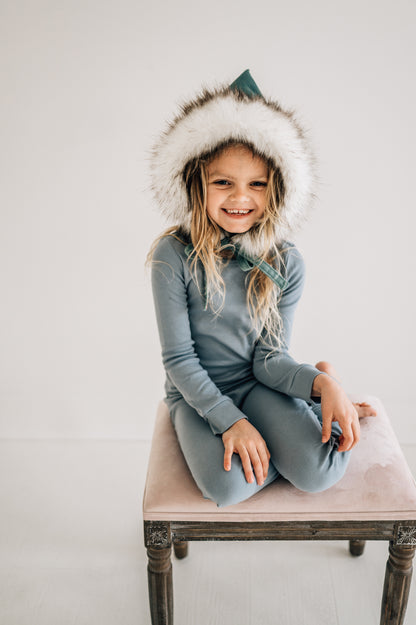 Organic Baby + Kids Pajama Set | Tradewinds — Child wearing the set seated on a stool