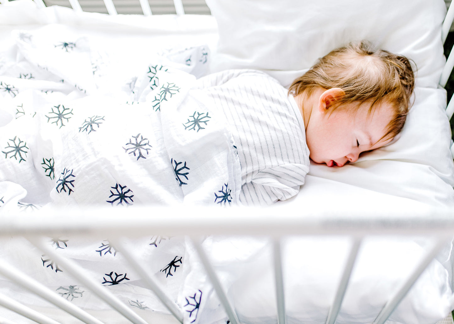 Snowflakes organic cotton muslin swaddle by Modern Burlap