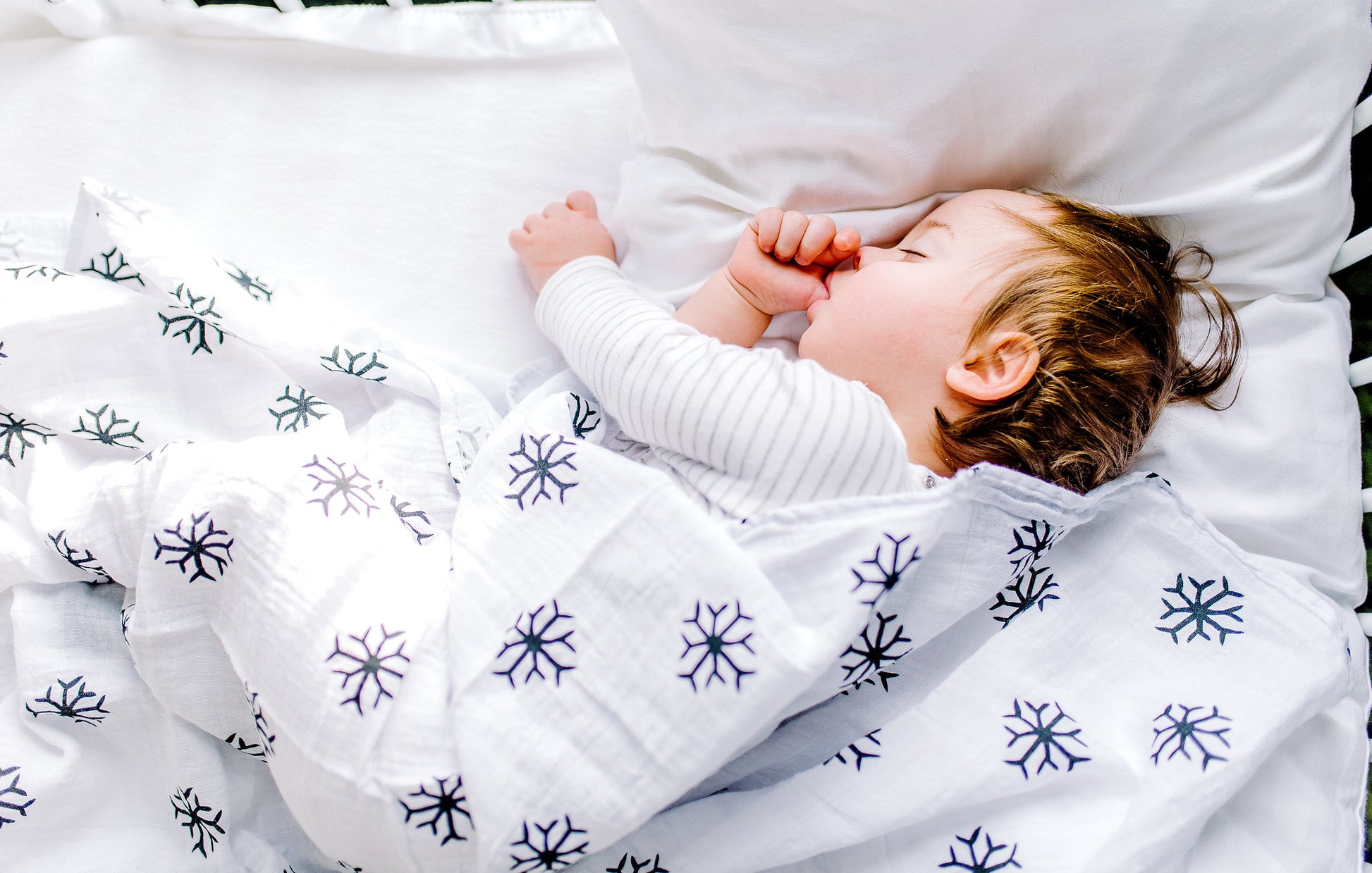 Snowflakes organic cotton muslin swaddle by Modern Burlap