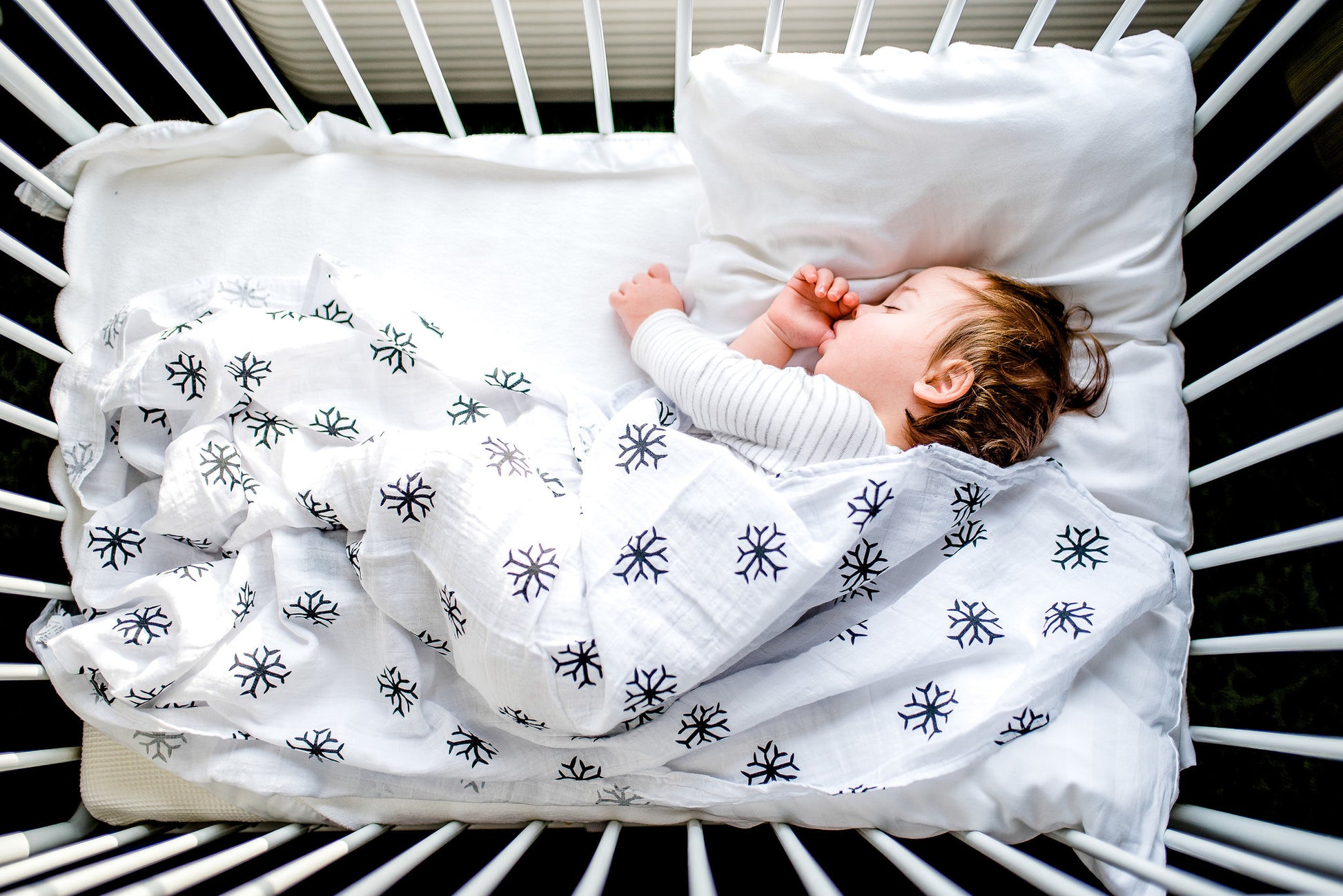 Snowflakes organic cotton muslin swaddle by Modern Burlap
