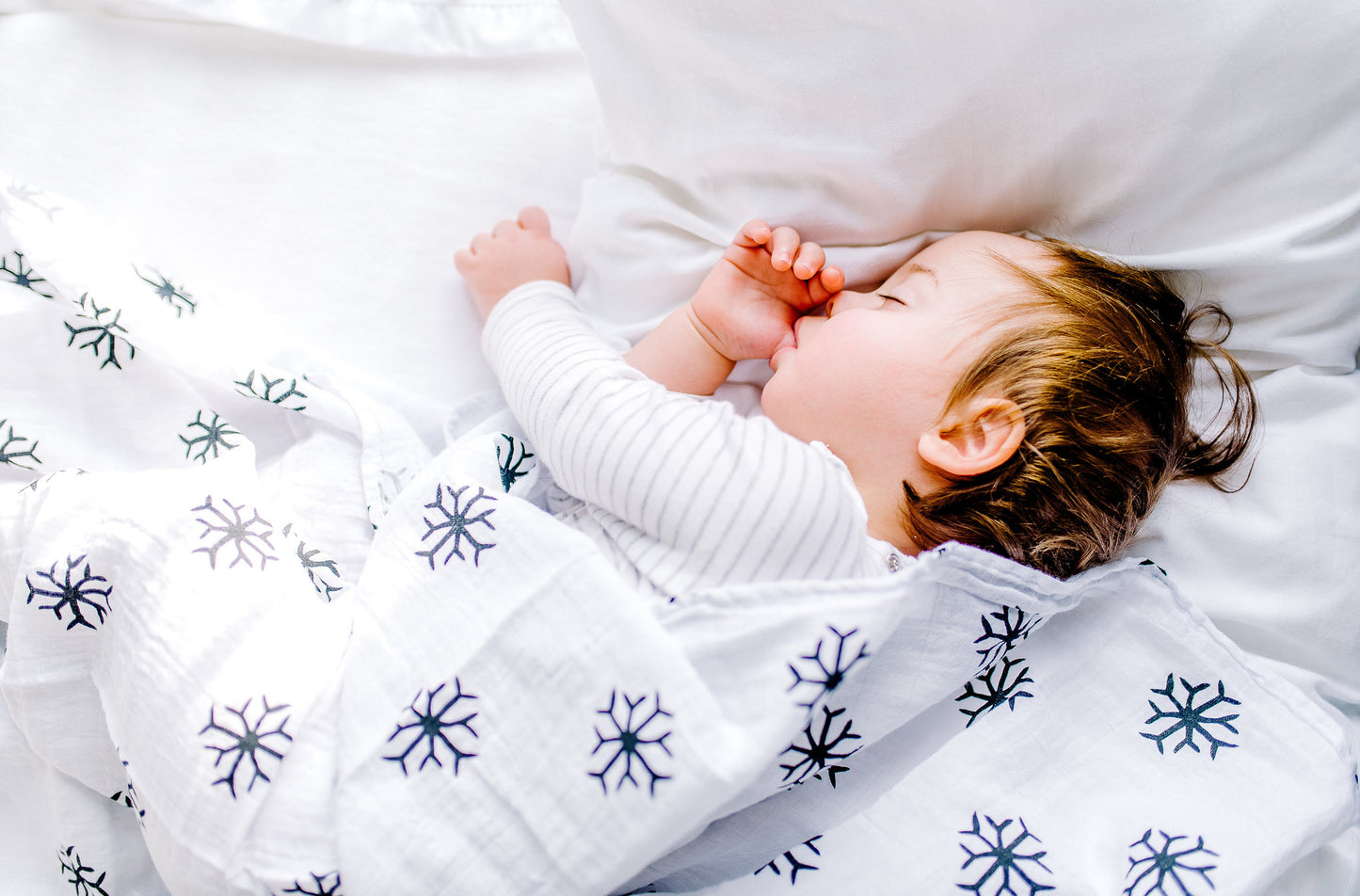 Snowflakes organic cotton muslin swaddle by Modern Burlap