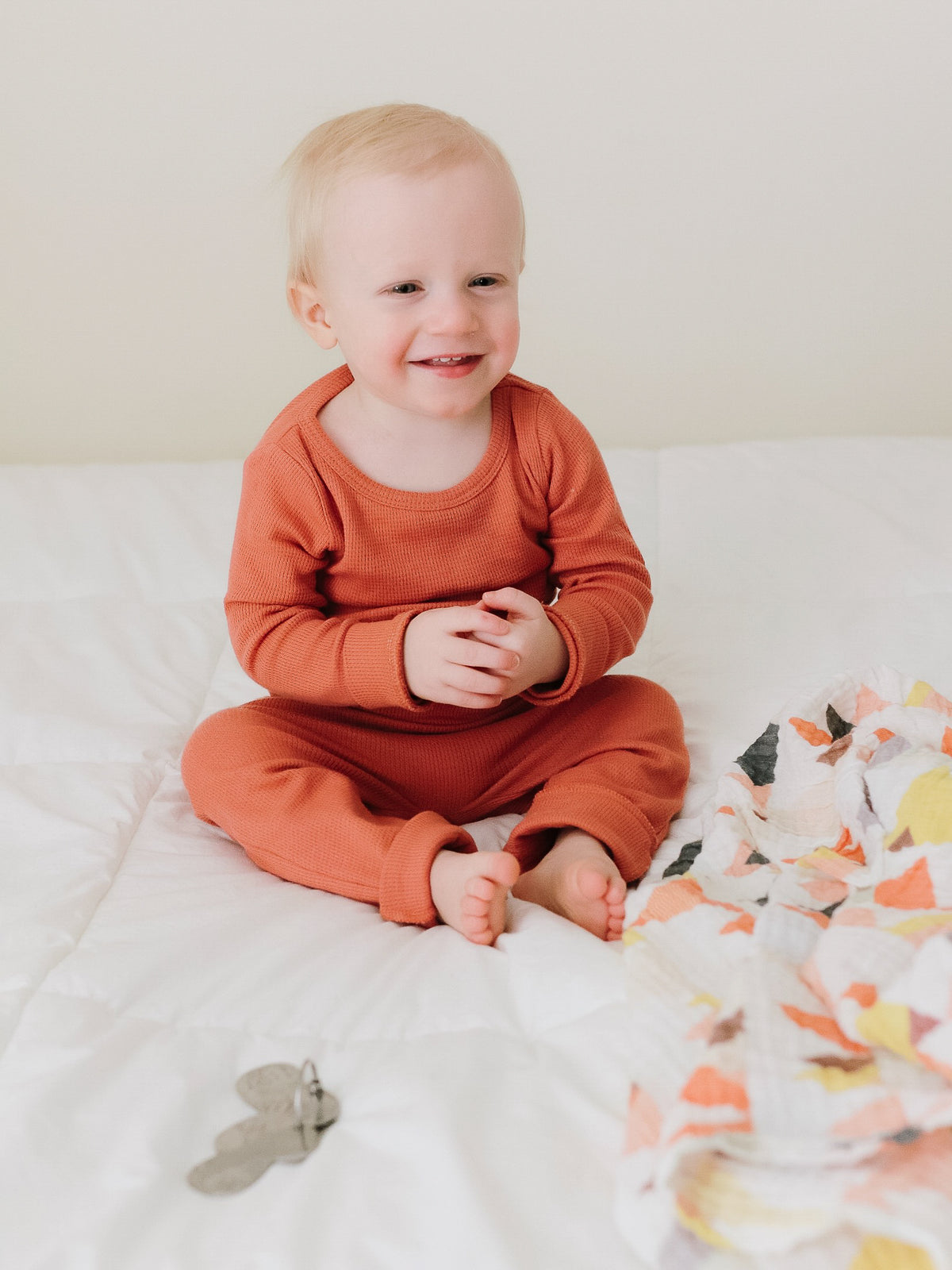 Organic Thermal Baby + Kids Pajama Set | Aragon — Baby seated in the full pajama set