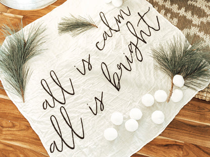 All Is Calm All Is Bright organic swaddle featuring lyrics from the hymn Silent Night