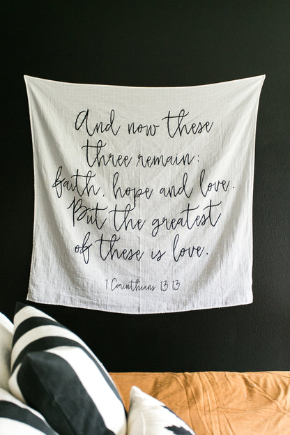 Wall display of 1 Corinthians 13:13 Scripture Swaddle.