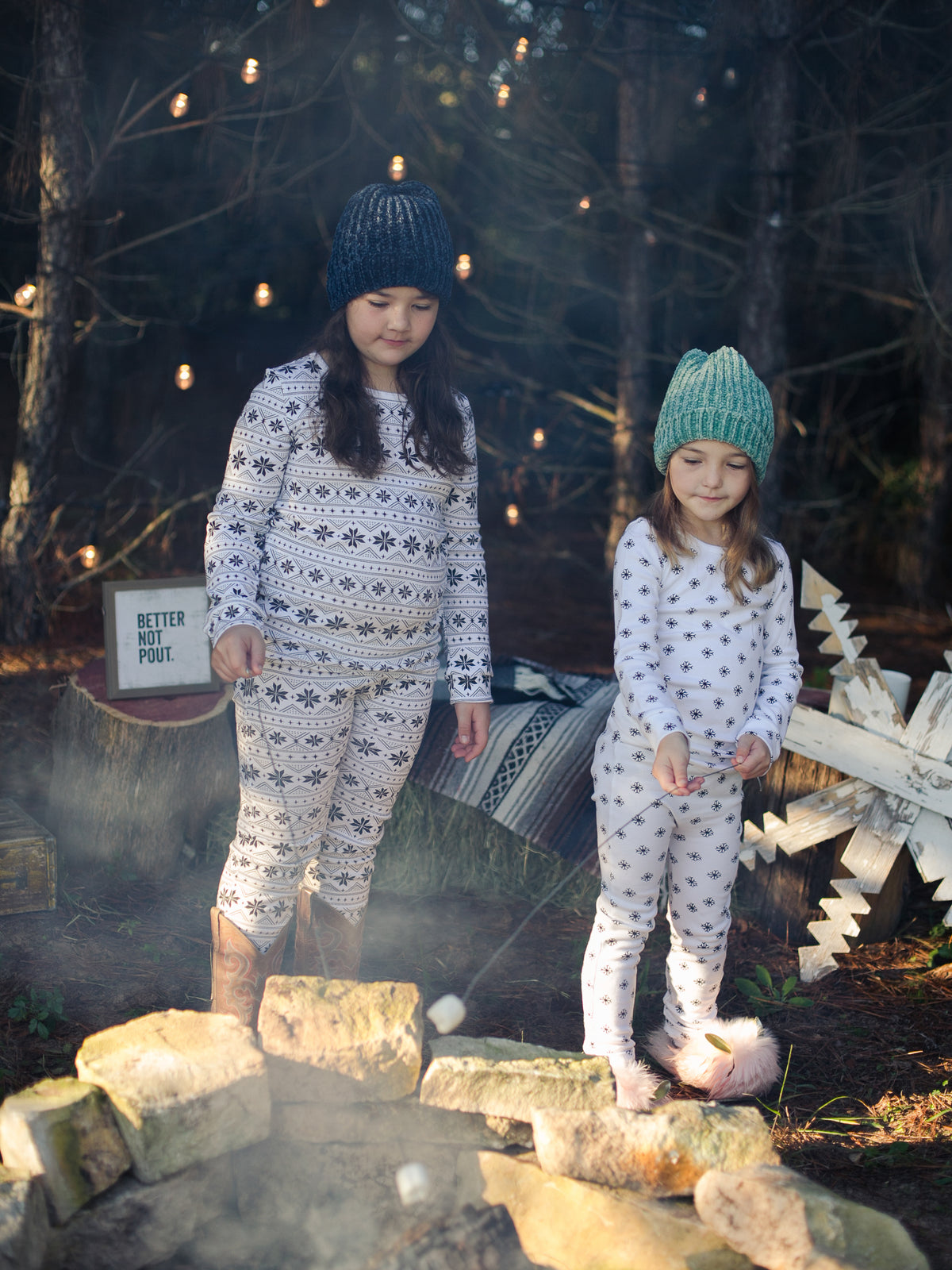 Organic Baby + Kids Pajama Set | Black on White Nordic Winter — Children wearing coordinating winter print pajamas outdoors