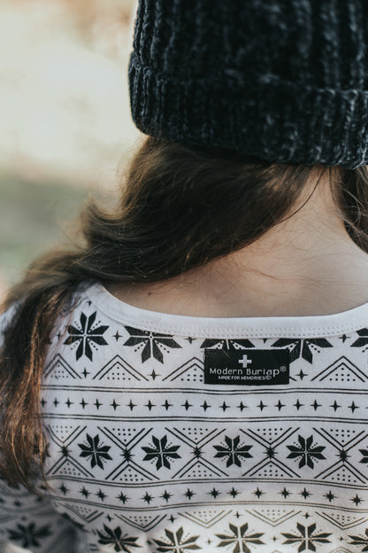 Organic Baby + Kids Pajama Set | Black on White Nordic Winter — Close-up of coordinating Nordic and snowflake prints