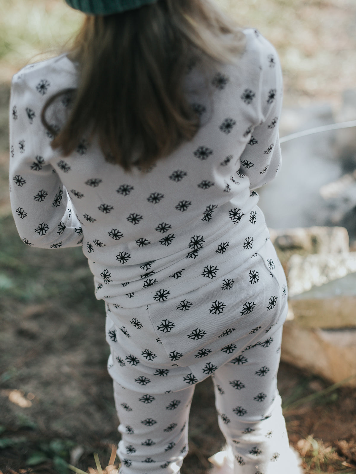 Organic Baby + Kids Pajama Set | Black on White Snowflakes — Back view of snowflake pajamas