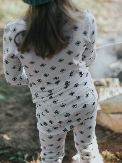 Organic Baby + Kids Pajama Set | Black on White Snowflakes — Back view of snowflake pajamas