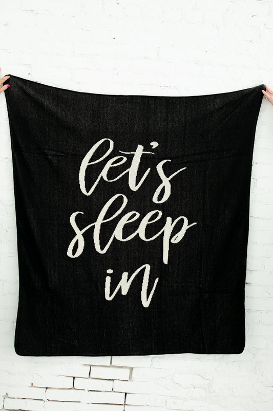 Let's Sleep In Recycled Cotton Throw Blanket — Black, showing the knitted design.