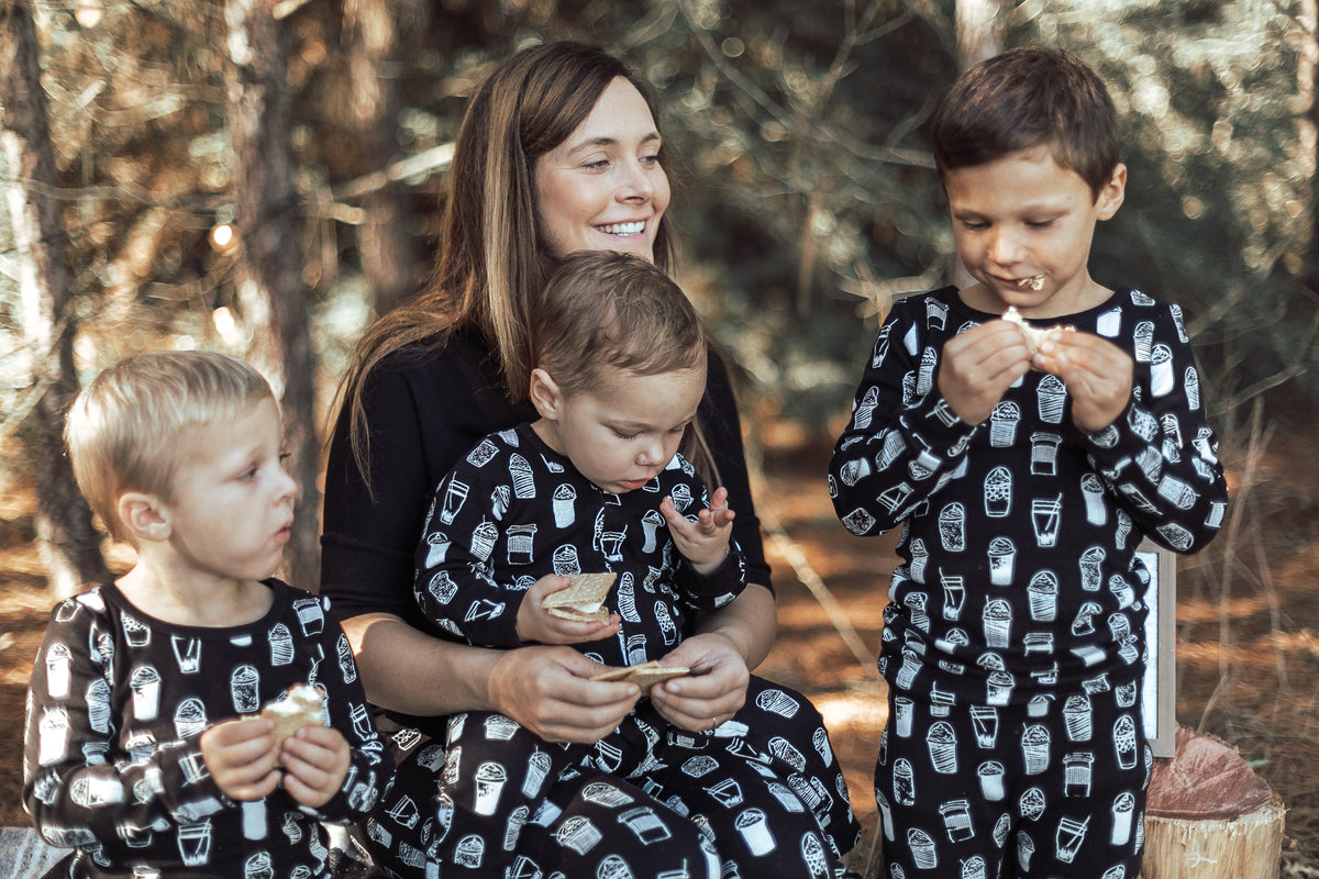 Organic Baby + Kids Pajama Set | White on Black Coffee Love — Family wearing matching coffee print pajamas
