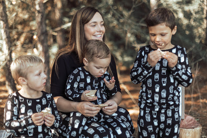 Organic Baby + Kids Pajama Set | White on Black Coffee Love — Family wearing matching coffee print pajamas