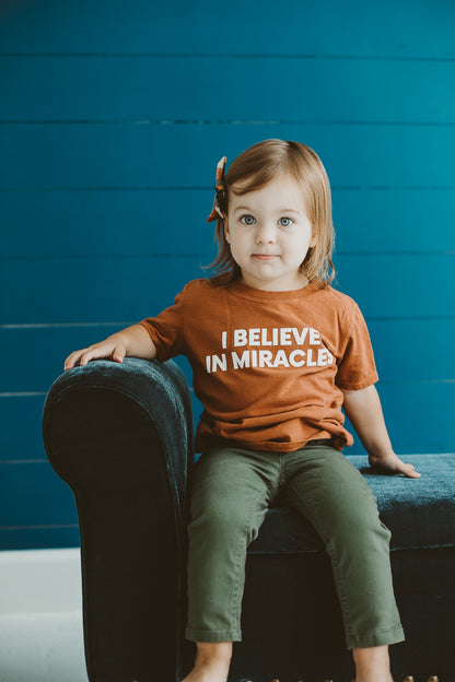 Made in the USA TEE FOR A CAUSE | I believe in miracles Kid S/S Crewneck Tee - Sunburn