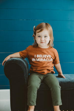 
                  
                    Load image into Gallery viewer, Made in the USA TEE FOR A CAUSE | I believe in miracles Kid S/S Crewneck Tee - Sunburn
                  
                